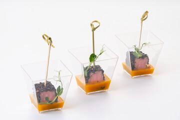 tuna and black sesame canapes on a white background. Catering services