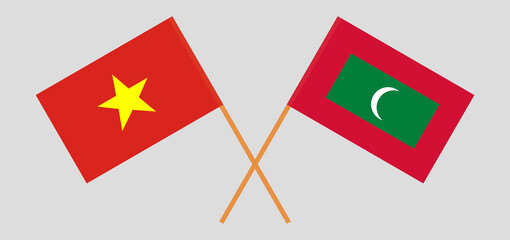 Crossed flags of Vietnam and Maldives. Official colors. Correct proportion