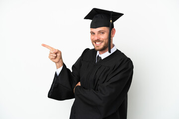 Young university Brazilian graduate isolated on white background pointing finger to the side