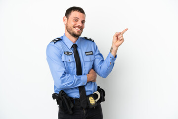 Young police Brazilian man isolated  on white background pointing finger to the side
