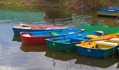 Fototapeta na wymiar Colorful wooden boats for rent