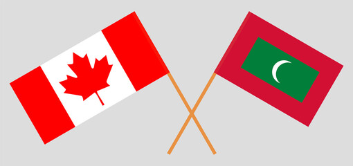 Crossed flags of Canada and Maldives. Official colors. Correct proportion