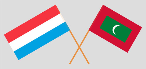 Crossed flags of Luxembourg and Maldives. Official colors. Correct proportion