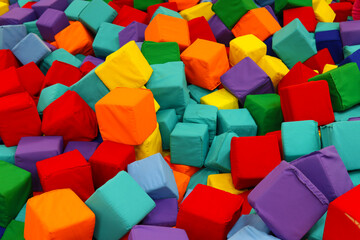 Fototapeta na wymiar soft colored cubes in the children's playroom