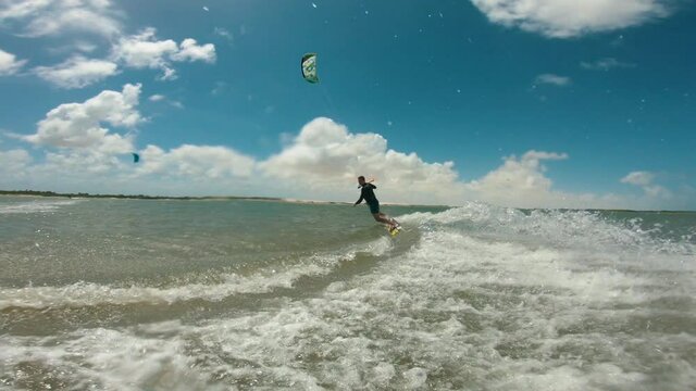 kitesurfer carving turn water splash gopro water sports lagoon summer brazil arins 4k
