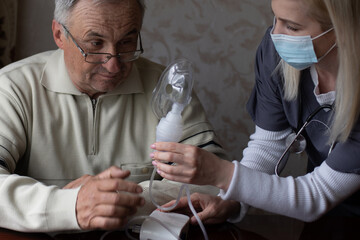 Elderly man on oxygen mask, nebulizer