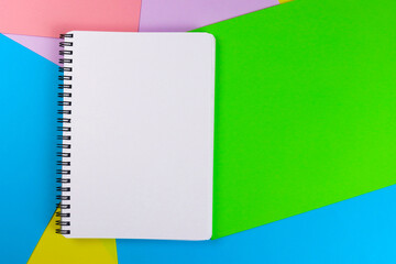 Blank notepad page on colored sheets of paper