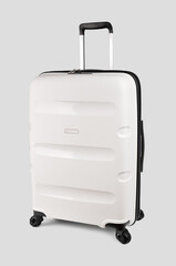Plastic travel suitcase. White suitcase isolated on white background. Polycarbonate suitcase isolated on white. White suitcase.