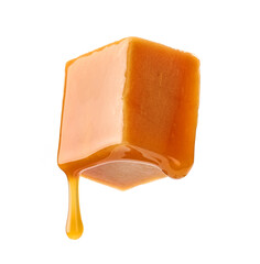 caramel sauce flowing on flying caramel candy
