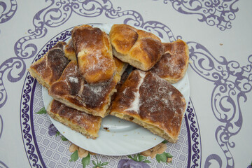 Breakfast,romanian homemade crullers, branzoici on a black tray