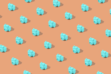 Travel pattern made of mint blue camera on beige background. Minimal summer creative concept.