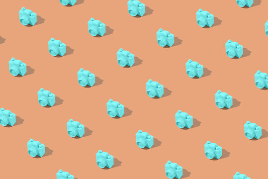 Travel pattern made of mint blue camera on beige background. Minimal summer creative concept.