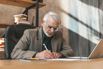 Bureaucratic documents. Senior man signs a will at the table. Notary at work.