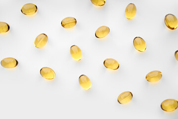 Omega-3 Fish Fat Oil Capsules. Fish oil capsules isolated on white background. Close up of capsules Omega 3 on white background. Health care concept. Nutritional supplements. Vitamins