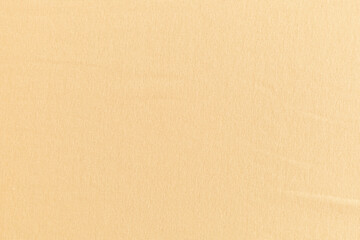 smooth surface of soft knitted fabric for sewing clothes in cream color, background, texture