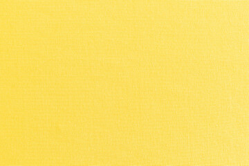smooth surface of soft knitted fabric for sewing clothes in bright yellow color, background, texture