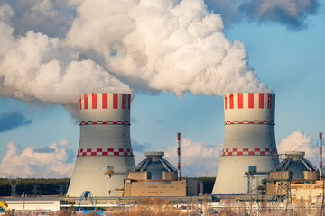 Cooling towers of Nuclear power plant emissions of steam in the air atmosphere. Industrial zone...