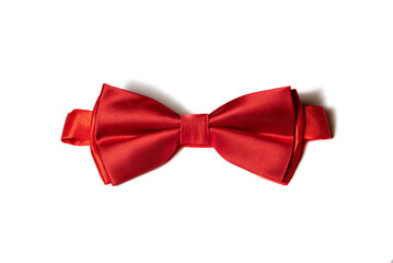 Red bow tie on a white background, close-up.