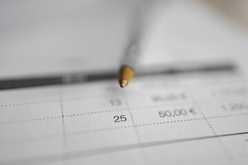 Invoice with a ballpen on the tabel, close up	