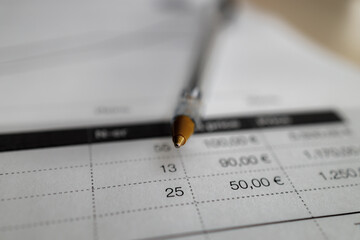 Invoice with a ballpen on the tabel, close up	