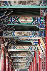 Polychrome wooden crossbeams and rafters-colonnade ceiling-Ming Qing food street....