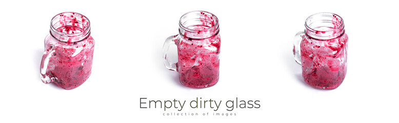 Empty dirty glass of berry smoothie isolated on white background.