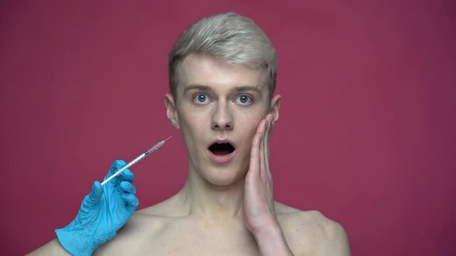 Doctor Holding Syringe With Injection Near Patient Face. Skin Treatment Concept 