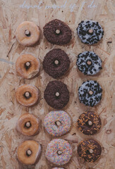 Fototapeta na wymiar Doughrings and donuts displayed on a board at a buffet or party