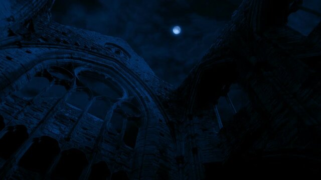 Looking Up At Abbey Ruins In The Moonlight