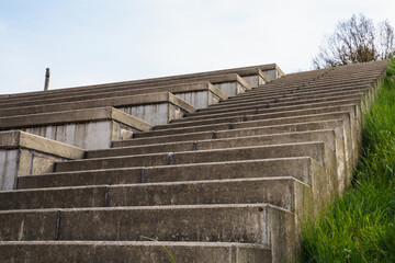 Fototapeta na wymiar Concrete steps in the sports stadium going up.