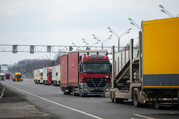a long traffic jam of many trucks at the border , a long wait for customs checks between States due...