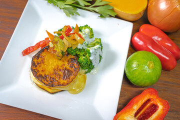 Healthy foods, full of vegetables and delicious flavors presented in white plate with colorful...