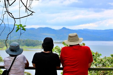 Mother, Father and daughter at view point on vacation Arenal lake Costa Rica  Quarantine end