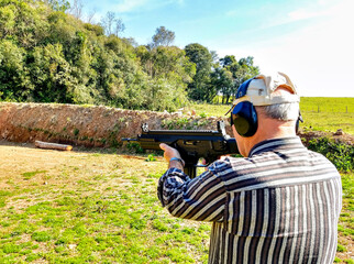 a man shooting with a gun