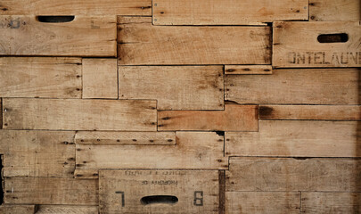 Wood background made of old wine crates in a wine cellar with aged texture