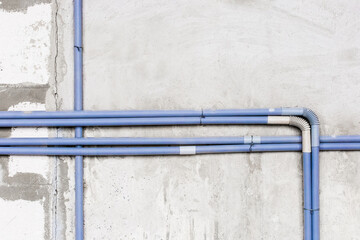 Plastic PVC pipe insulation on construction concrete home wall repair