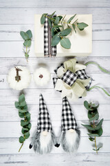 On-trend farmhouse aesthetic flatlay flatlay with farmhouse style decor, stack of books, and bows...