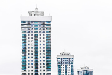 New modern high-rise apartment urban building exterior, facade of a residential city house