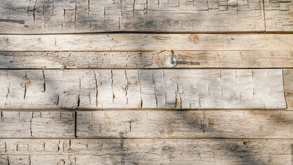 Antique reclaimed wood background with aged boards lined up. Wooden floor planks with grain and texture.