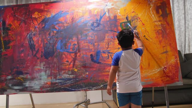 Little Boy Working On Abstract Painting
