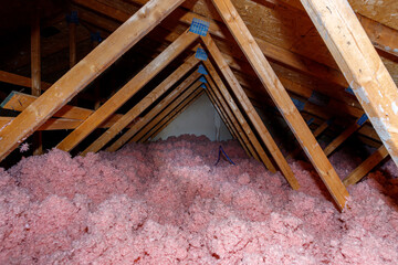 Attic with loose-fill fiberglass insulation