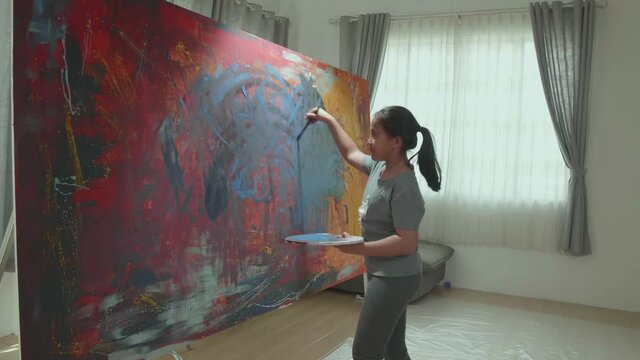 Asian Girl Uses Paint Brush To Create Daringly Emotional Modern Picture
