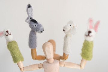 two artist's manikins (mannikins) posing with rabbit, sheep, and donkey finger puppets