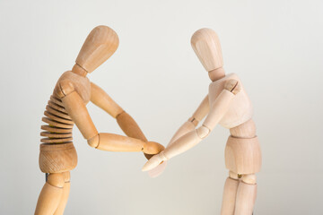 two artist's manikin (mannikin) acting and reacting on a mock stage