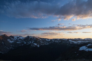 Fototapeta na wymiar Dramatic colorful sunset and clouds over Rocky Mountain National Park mountain range, Colorado