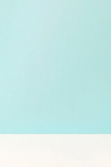 Obraz premium Background of a light blue wall and the floor of the white. 水色の壁と白色の床の背景素材