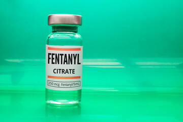 A Fentanyl Citrate vial on a green background