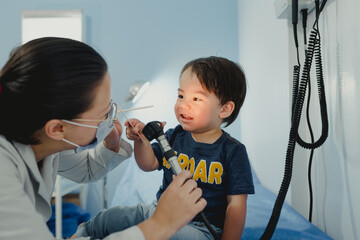 Dr. pediatrician with attending toddler