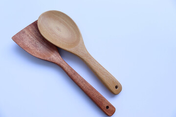 Wooden spoons kitchenware isolated on white background closeup. 