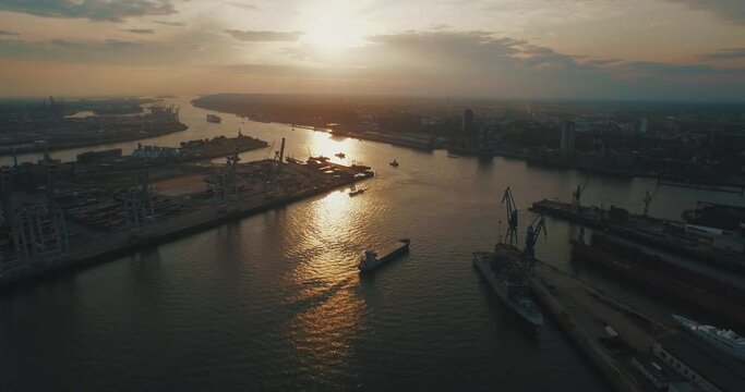 hamburg harbour sunset boat aerial panorama overview drone industrial container boat 4k